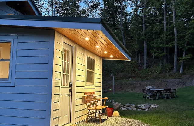 Just listed! Remodeled, brookside cottage nestled in private, 20-acre forest