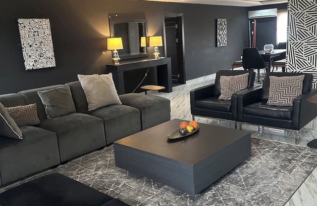 Chic and Spacious: Modern 4-Bedroom Flat with a Sleek Black Twist