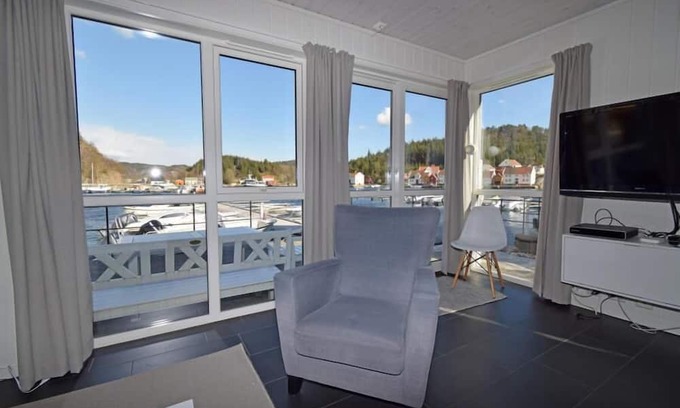 Lindesnes Maison | Holiday home 'Furuholmen Brygge 7', Furuholmen peninsula near Lindesnes, southern Norway, up to 7 people possible, e.g. 4 adults and 3-4 kids, 4 bedrooms, 2 shower-bathrooms, modern equipment, terrace and boat mooring in front of the house on the .