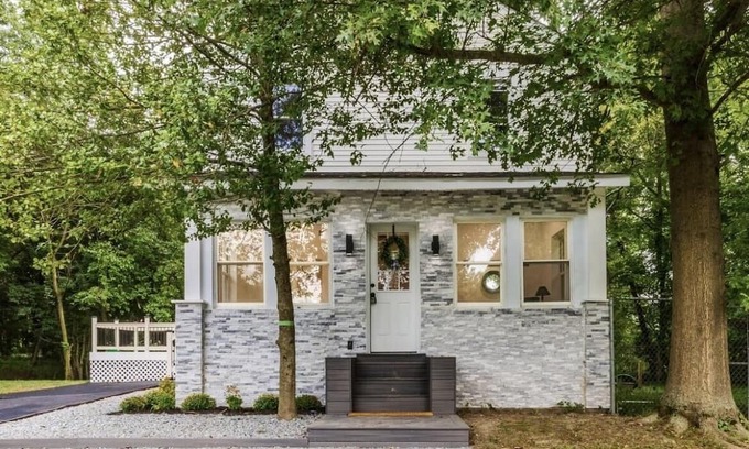 Mickleton Maison | Embrace the charm of our creekside haven featuring 4BR 3BA yoga and BBQ deck.